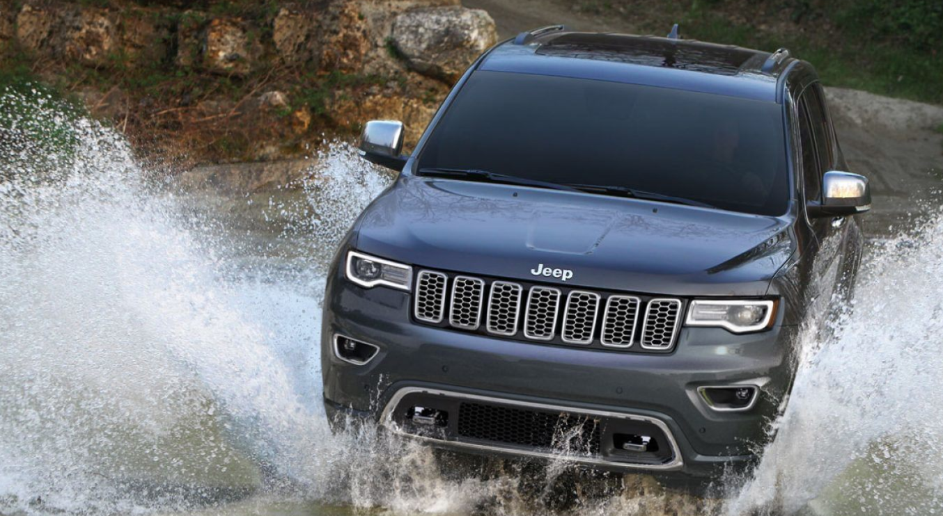 Image of a 2019 Jeep Grand Cherokee driving through water.